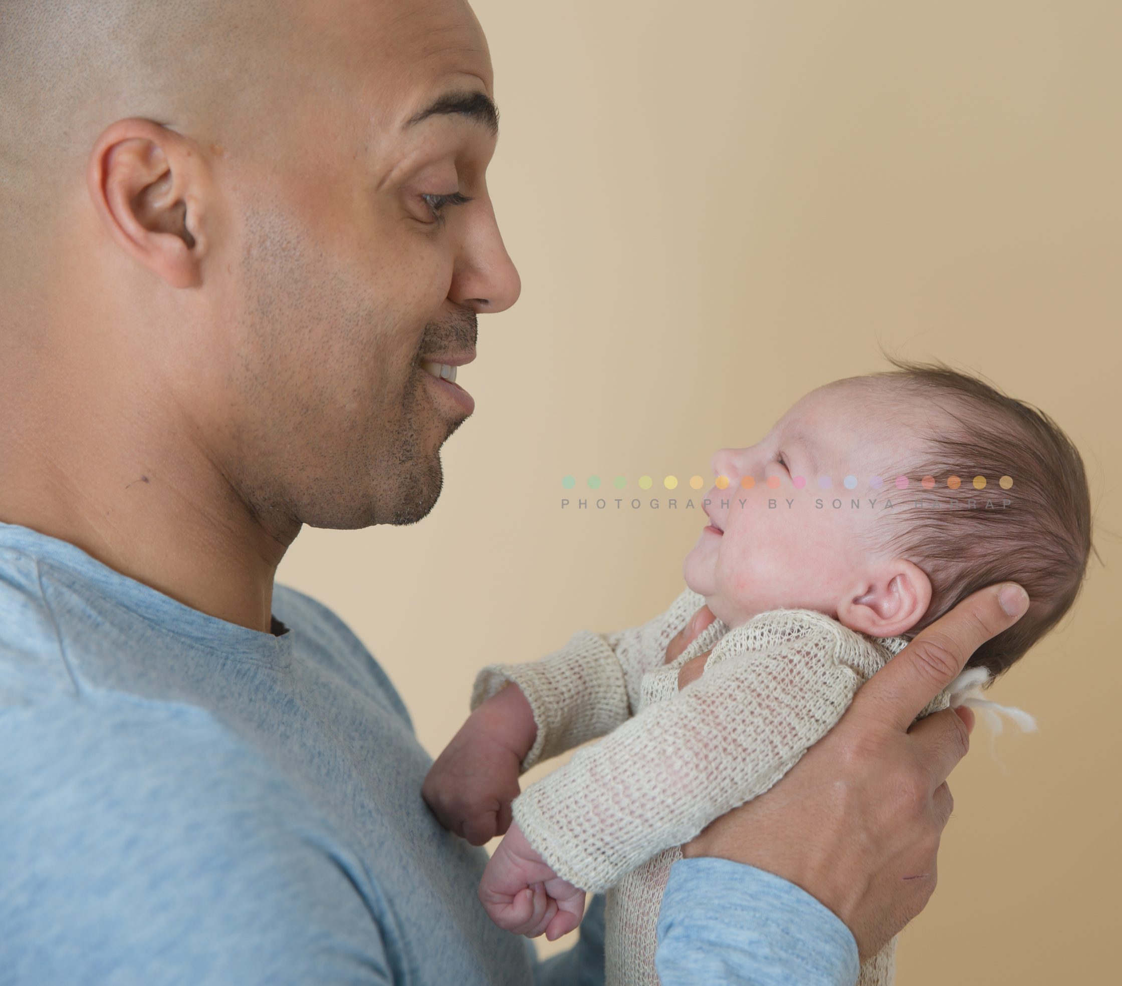 Newborn baby father and son photograph by Sonya Harrap Photograohy in Hertfordshire