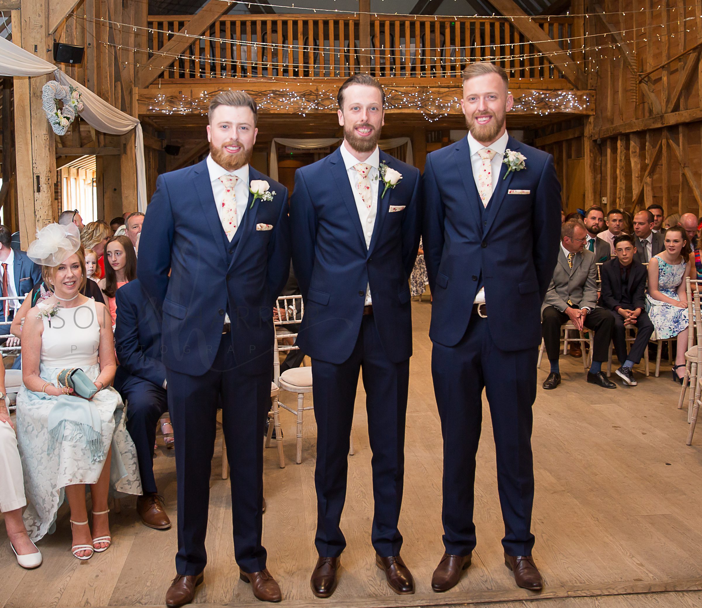 three brothers and groom waiting for the bride Tewinbury farm hotel outdoor wedding photograph of bride and groom by Sonya Harrap photographer