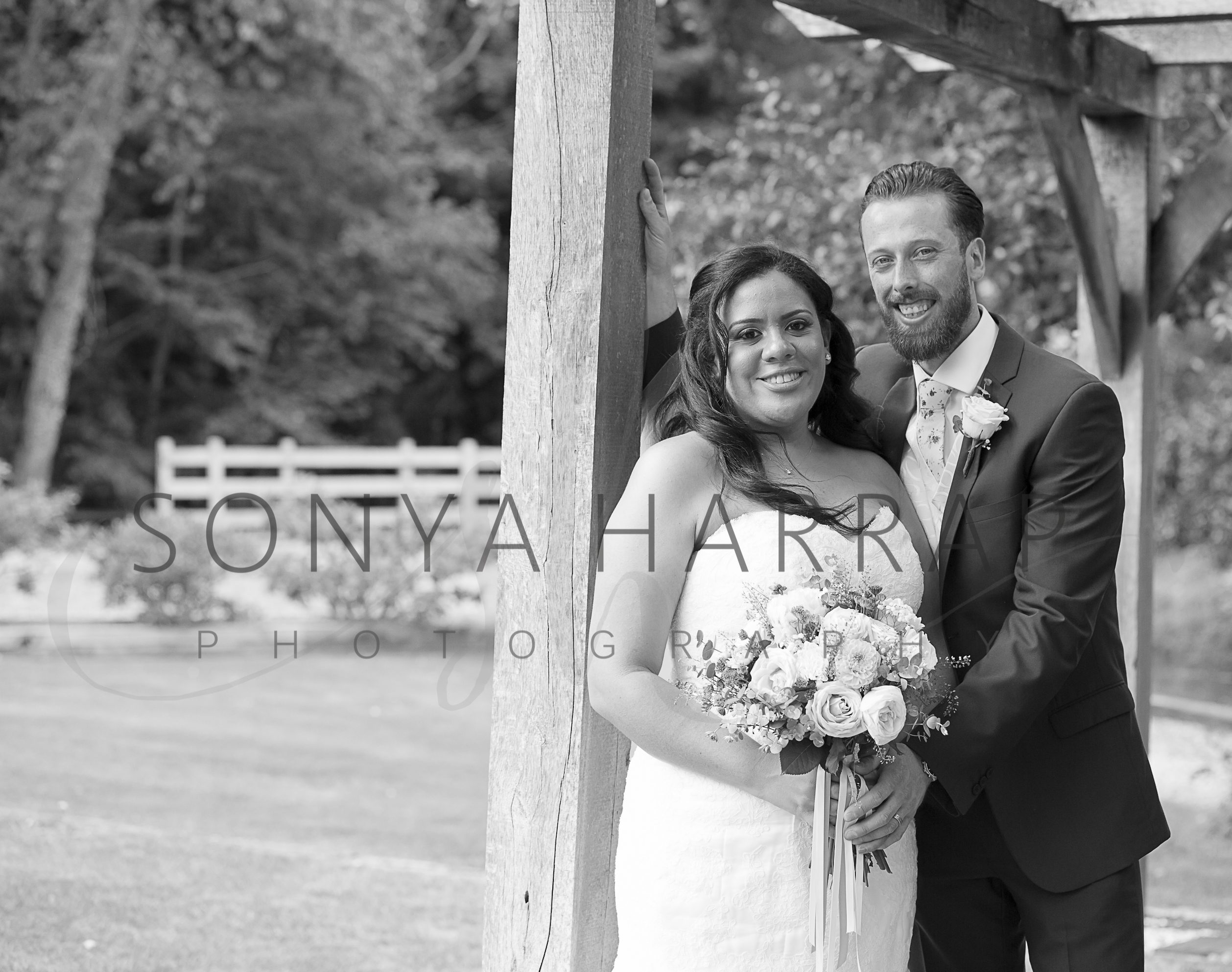 Tewinbury farm hotel wedding photograph of bride and groom by Sonya Harrap photographer