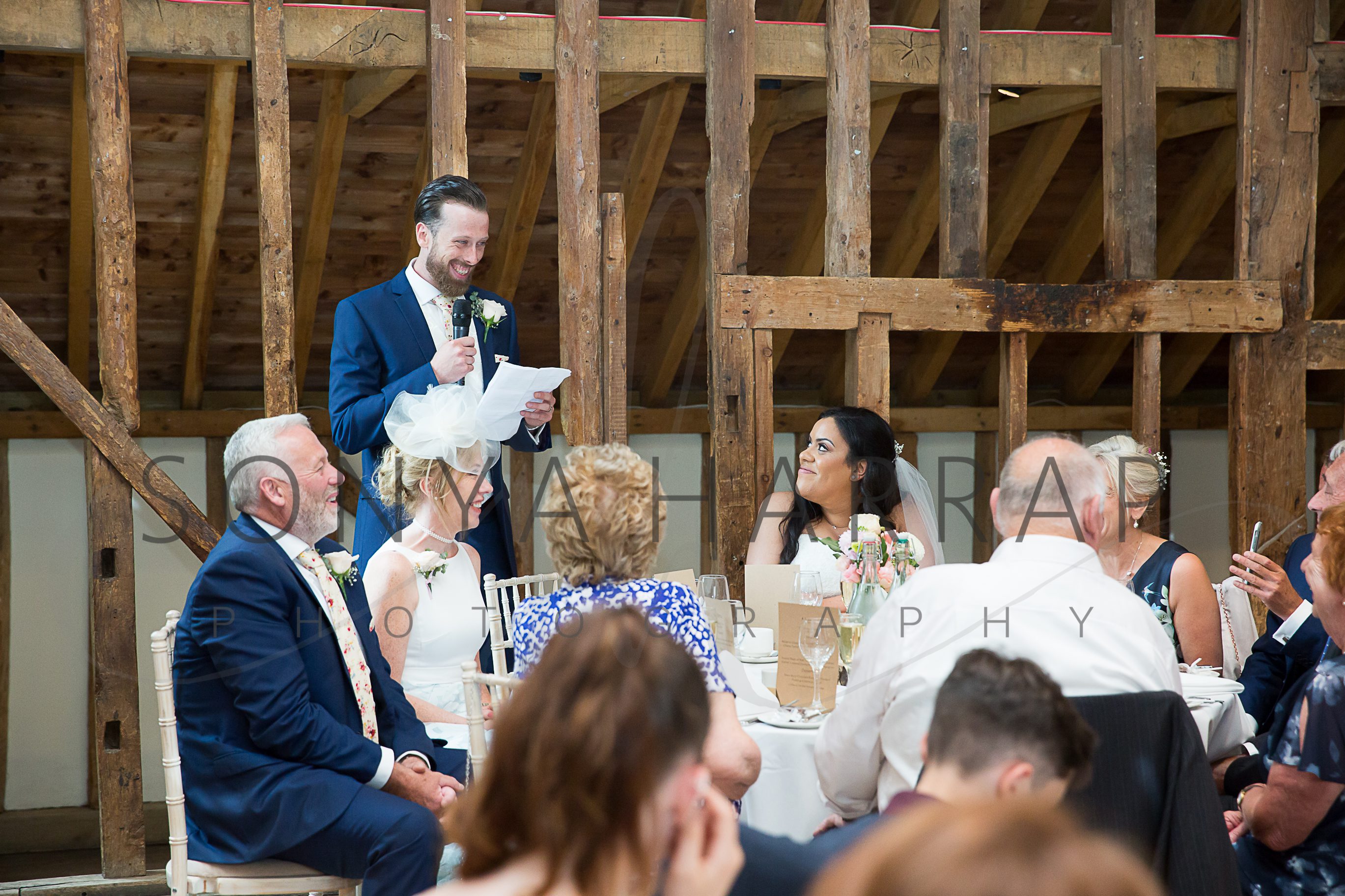 Tewinbury farm hotel wedding photograph of bride and groom by Sonya Harrap photographer grooms speech
