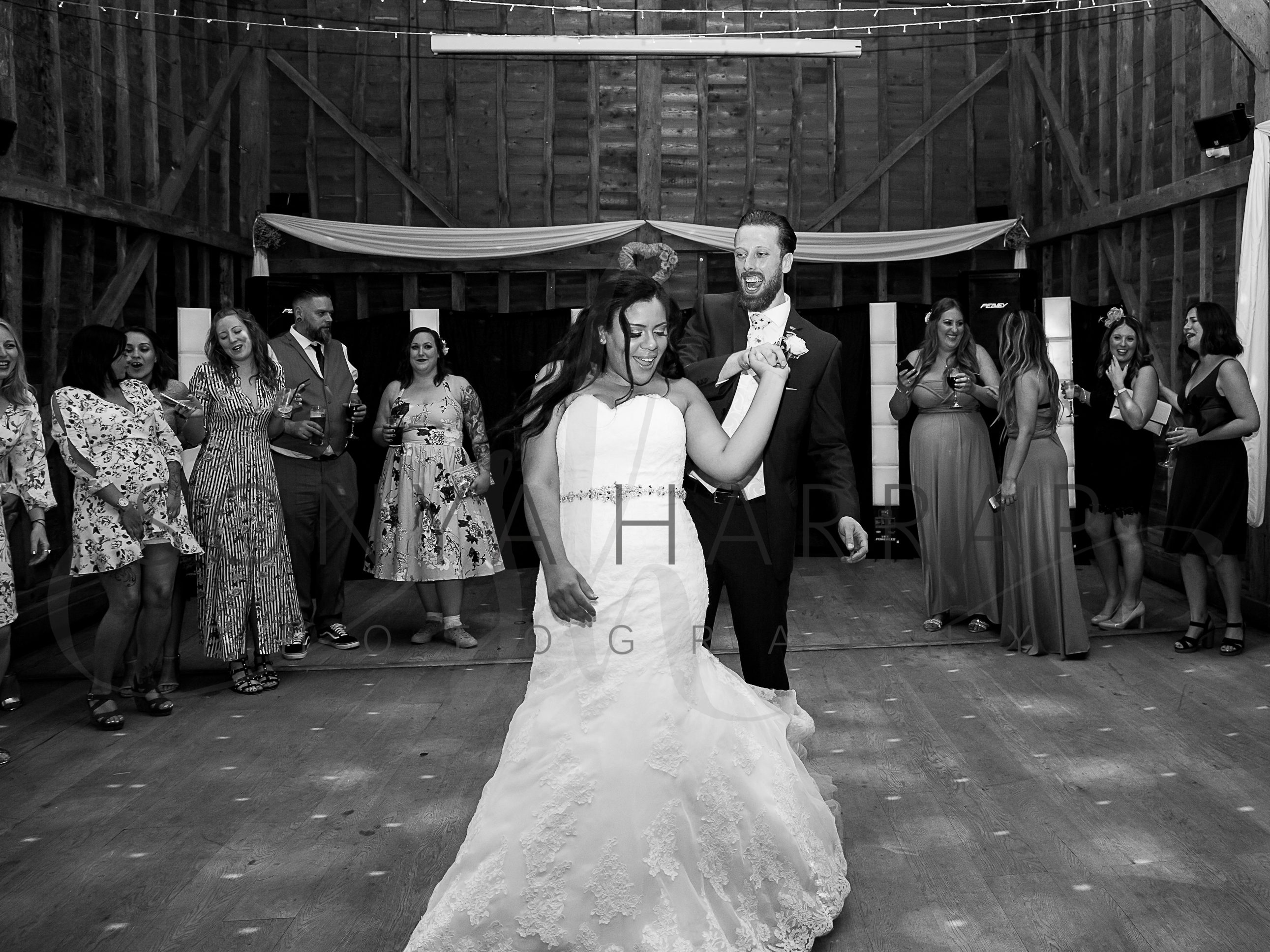 1st dance Tewinbury farm hotel wedding photograph of bride and groom by Sonya Harrap photographer confetti shot