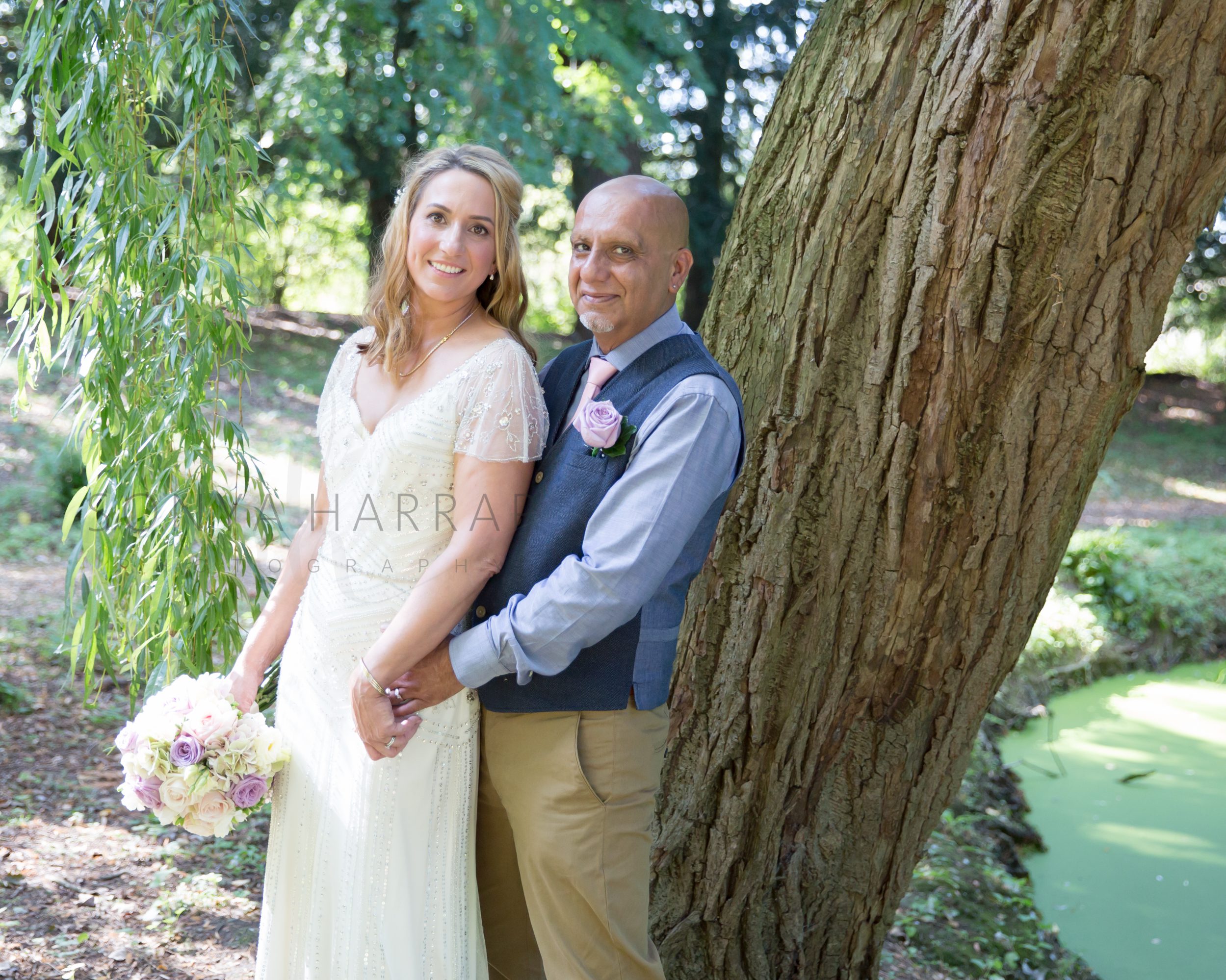 posed wedding in oriental gardens Fanhams hall ware wedding by Sonya Harrap Photography