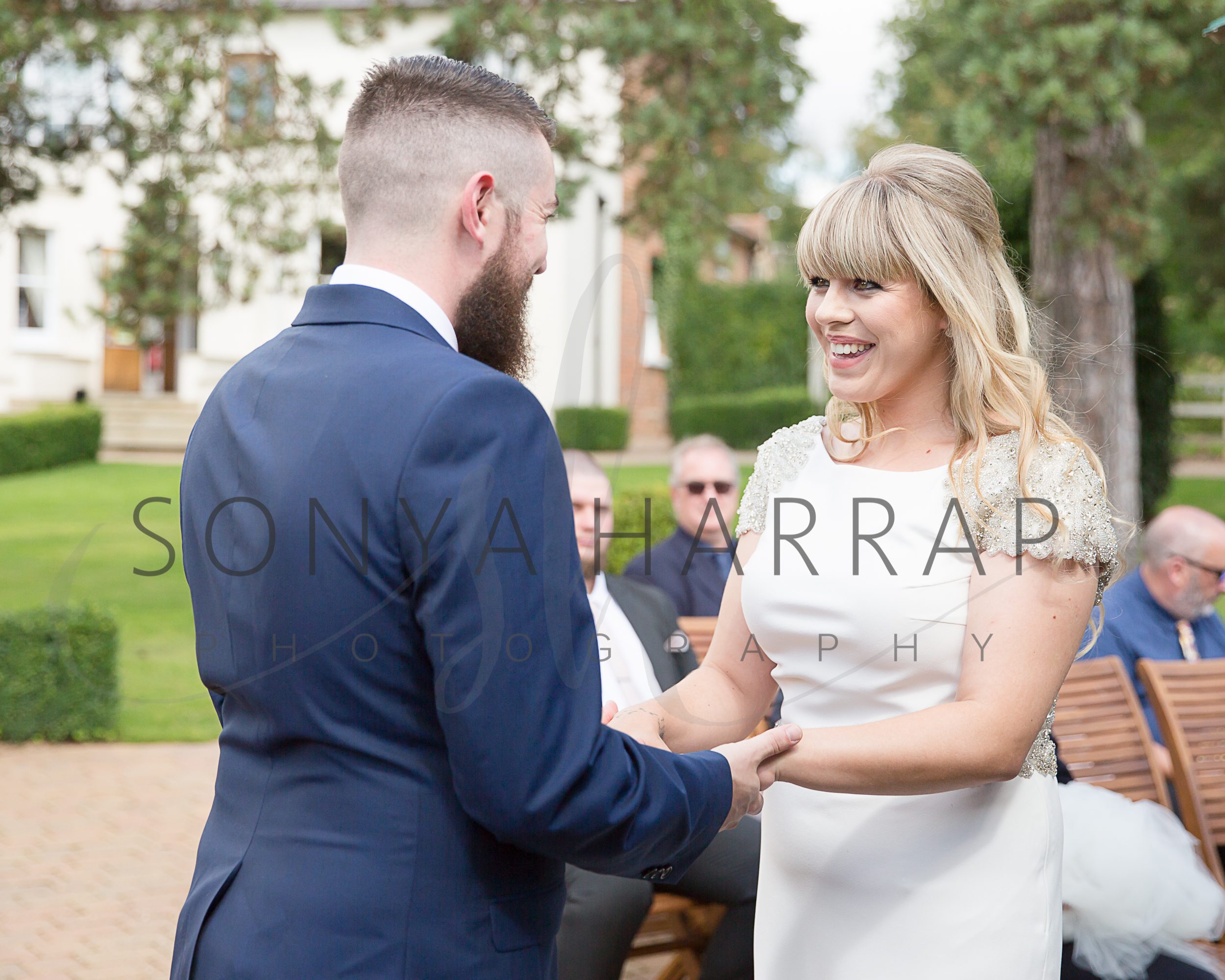 Tewinbury farm hotel wedding photograph of bride and groom by Sonya Harrap photographer