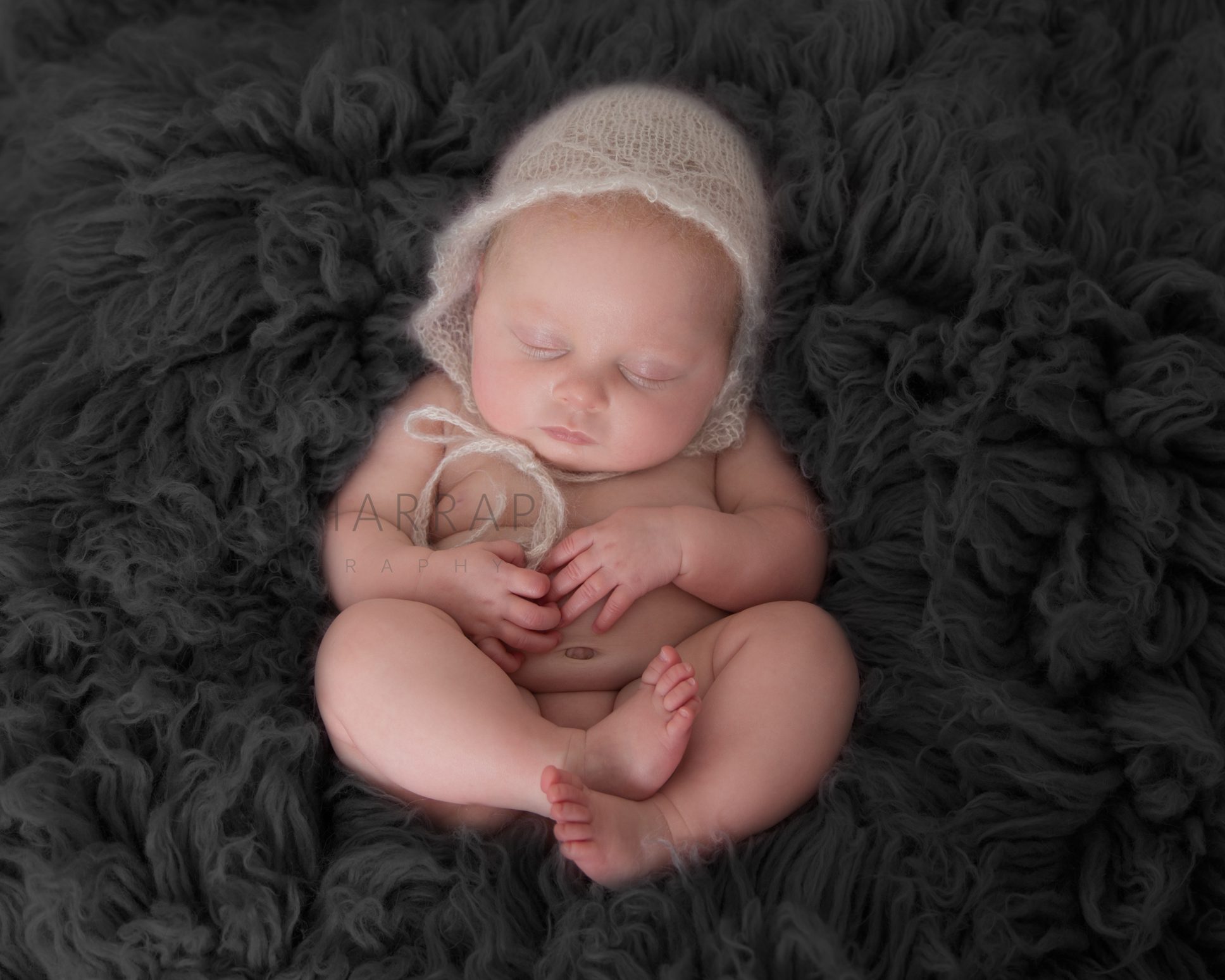 Newborn baby photograph with baby in butterfly and bowl setting. 5 days old baby girl