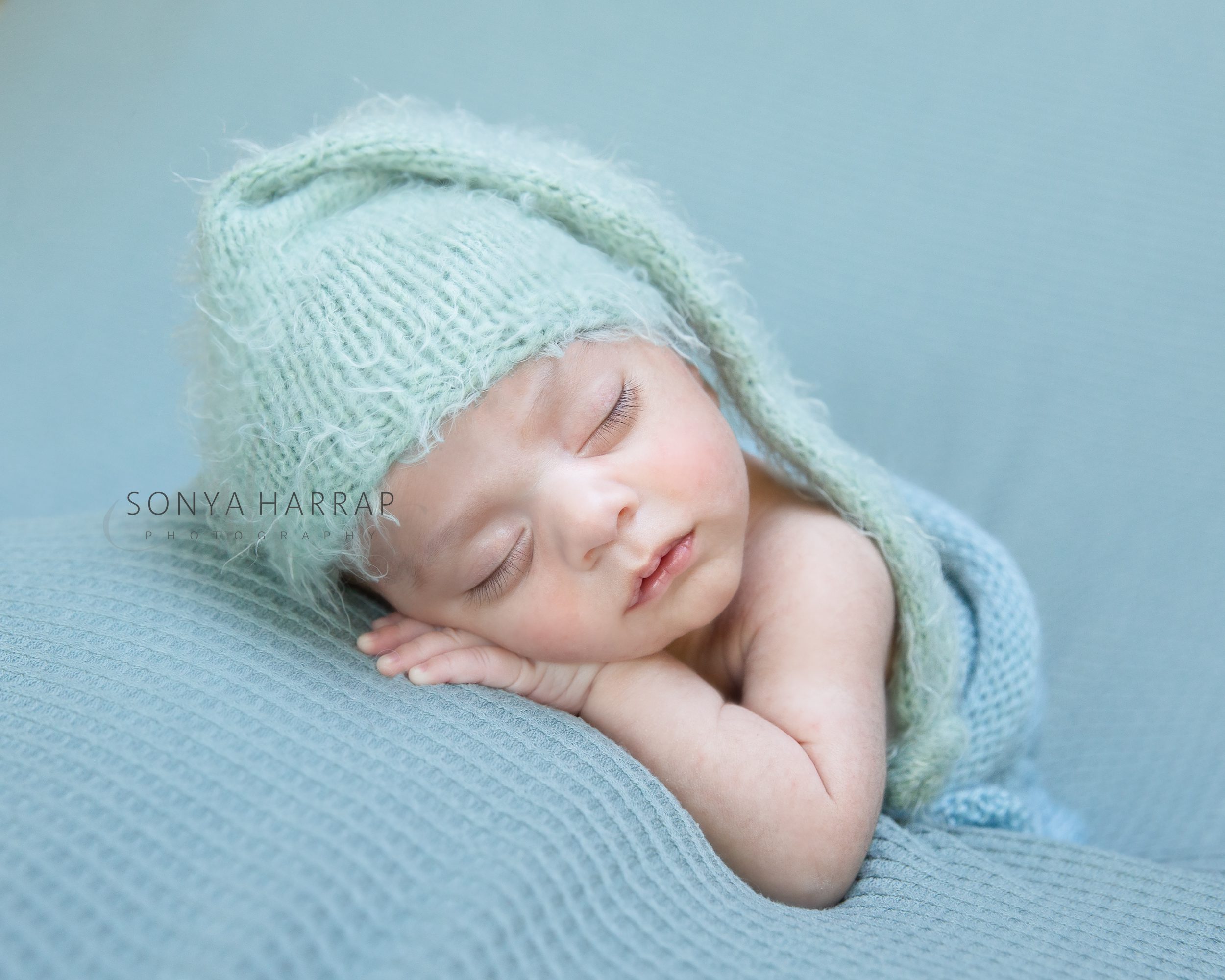 Baby boy newborn photoshoot in mint green by Sonya Harrap