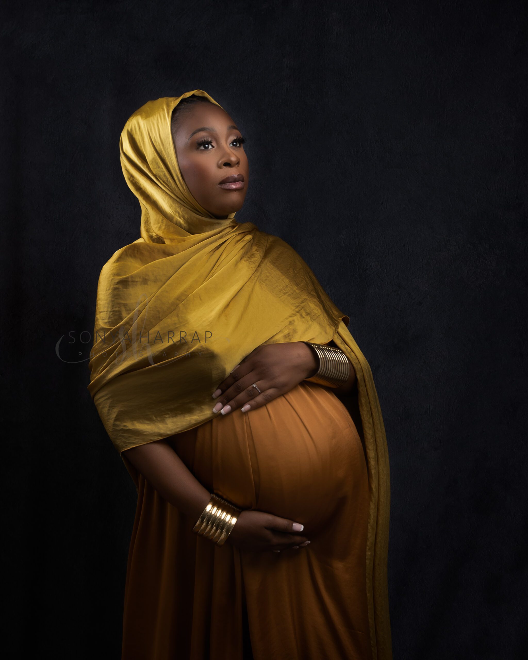 Modest maternity photoshoot with gold headscarf