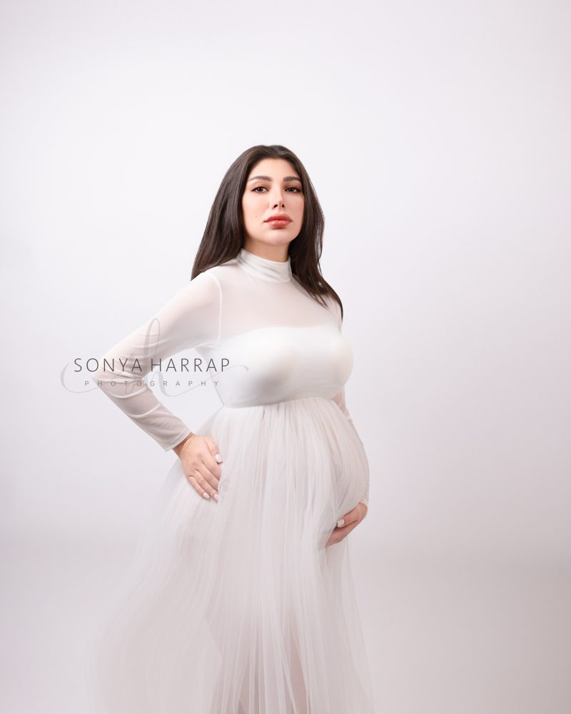 Light etherial maternity photo in pink- maternity photoshoot by best maternity photographer Sonya Harrap