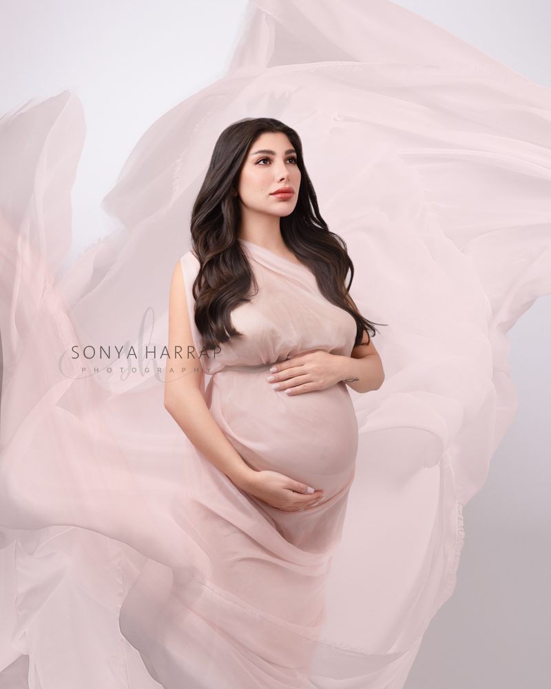 Light etherial maternity photo in pink- maternity photoshoot by best maternity photographer Sonya Harrap