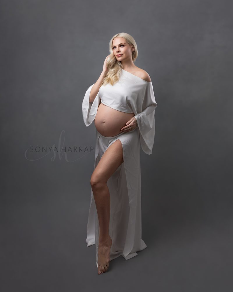 maternity pregnancy photoshoot by Sonya HARRAP Hertfordshire and London Photographer - woman in green and blue fabric dress brown dress fabric