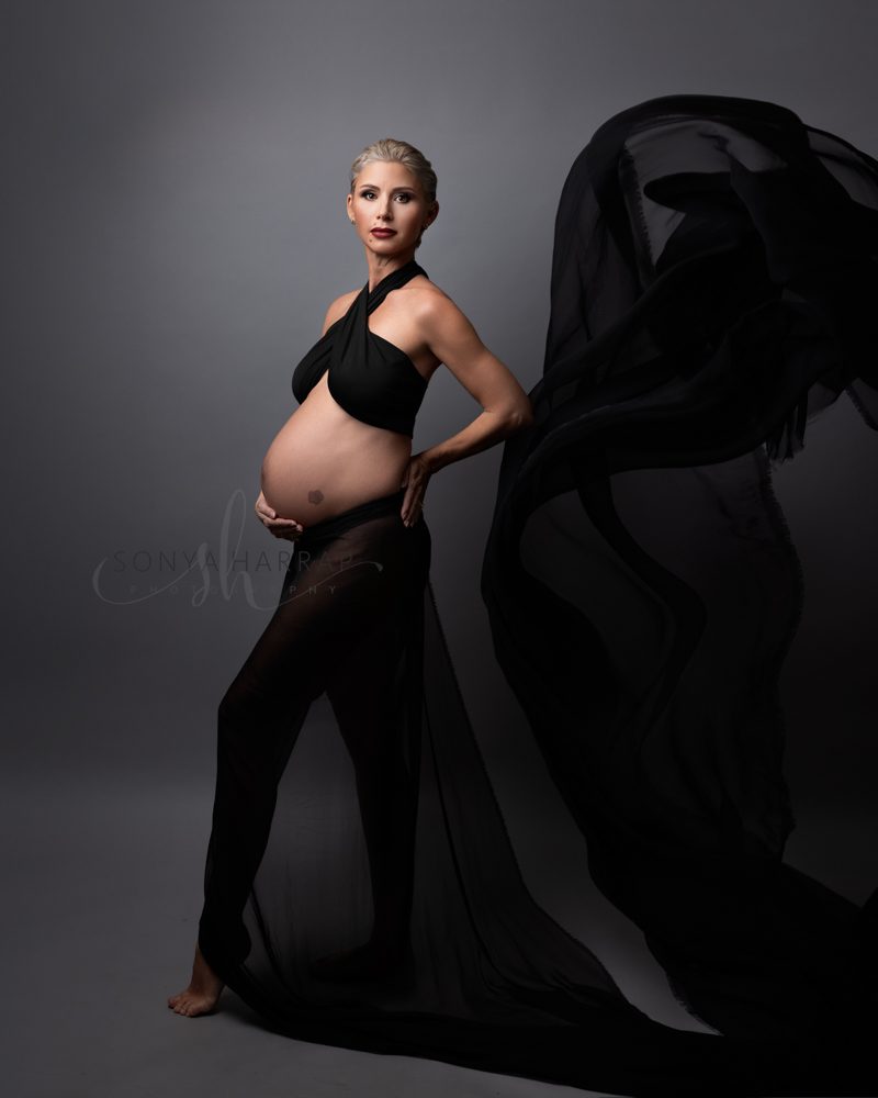 maternity pregnancy photoshoot by Sonya HARRAP Hertfordshire and London Photographer - woman in green and blue fabric dress brown dress fabric
